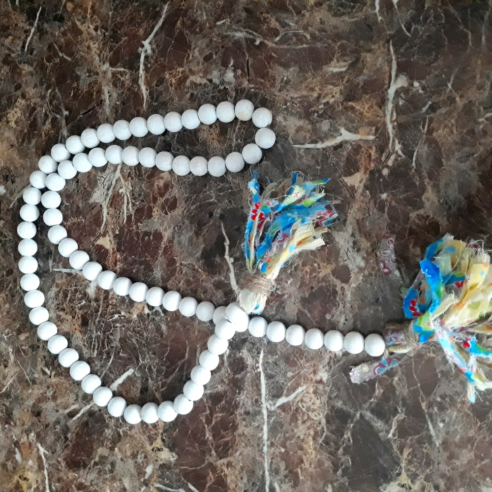 White decorative beads w/ tassel